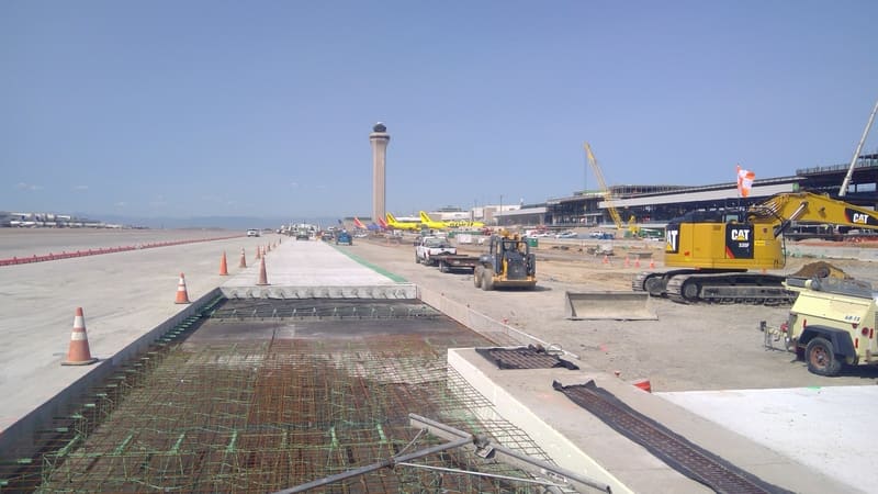 The construction of a runway at an airport.