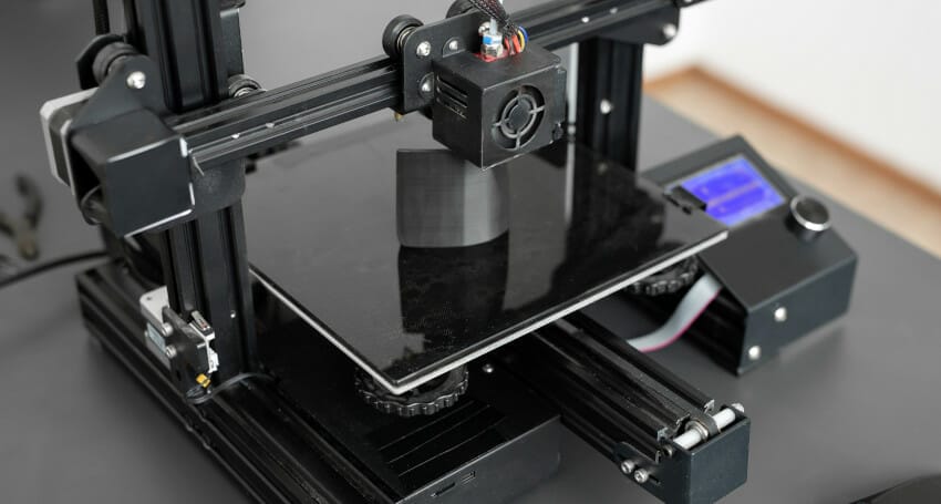 A innovative 3D printer sitting on top of a table for civil engineering projects.