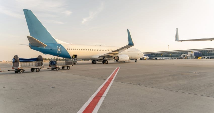 An airplane is parked on the tarmac at an airport.